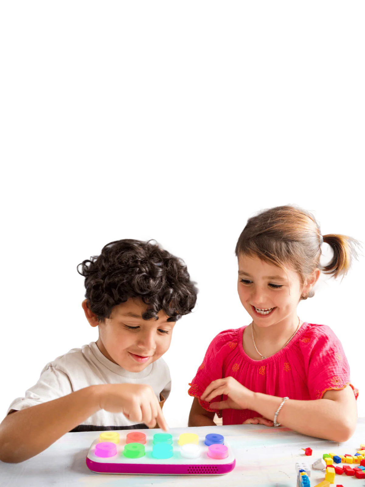 Two children playing with colorful toys on a white background