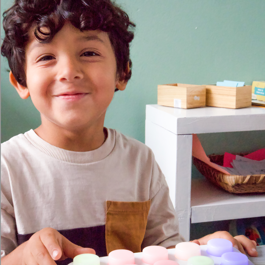 Child playing with Boppo in a classroom setting