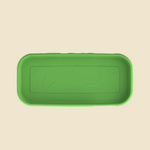 A green rectangular silicone tray with rounded corners and embossed abstract sun and circle patterns inside, shown from a top-down view on a light beige background.