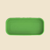 A green rectangular silicone tray with rounded corners and embossed abstract sun and circle patterns inside, shown from a top-down view on a light beige background.