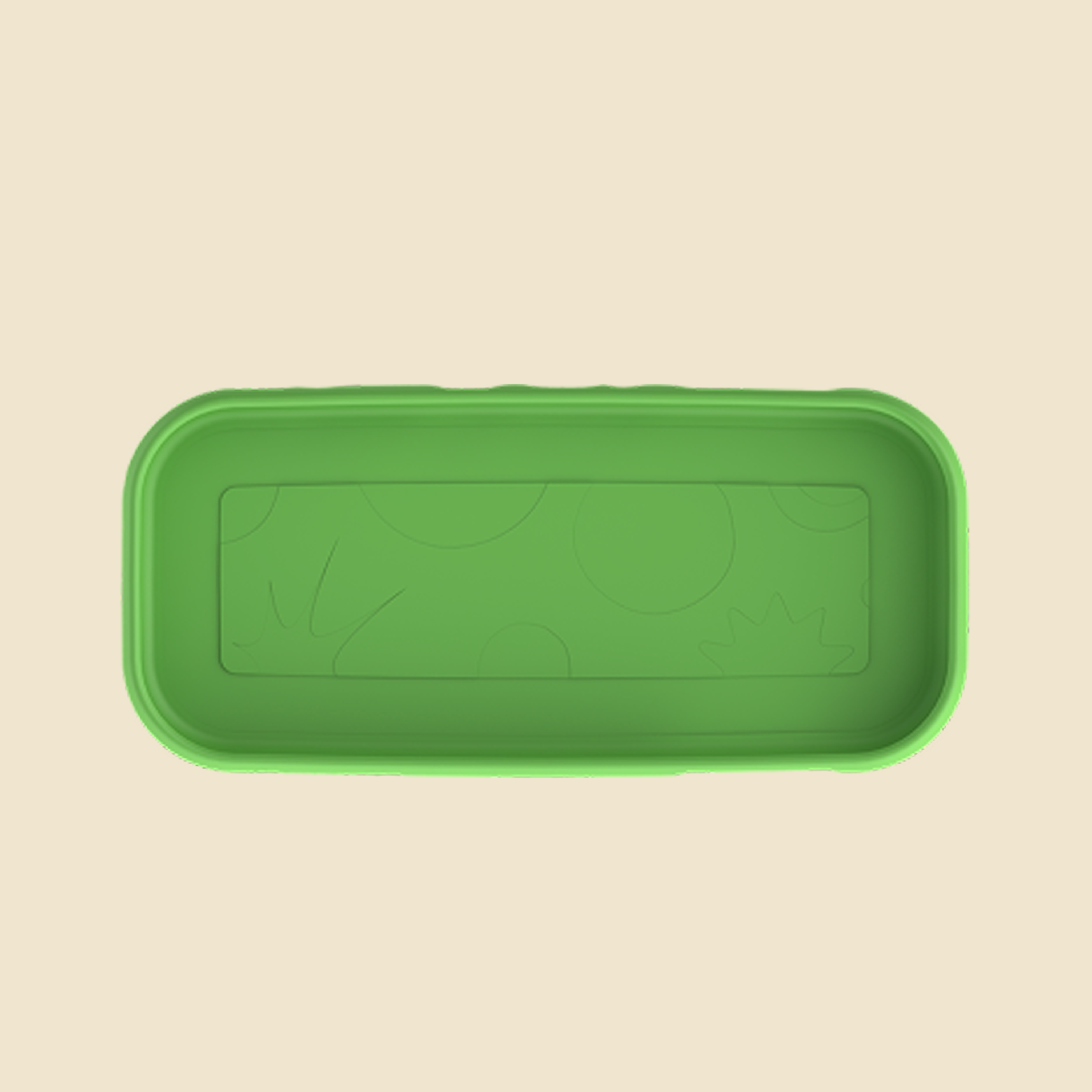 A green rectangular silicone tray with rounded corners and embossed abstract sun and circle patterns inside, shown from a top-down view on a light beige background.