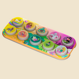 A colorful children's toy tray with ten circular cutouts showing different fantasy characters, photographed on a plain light beige background.