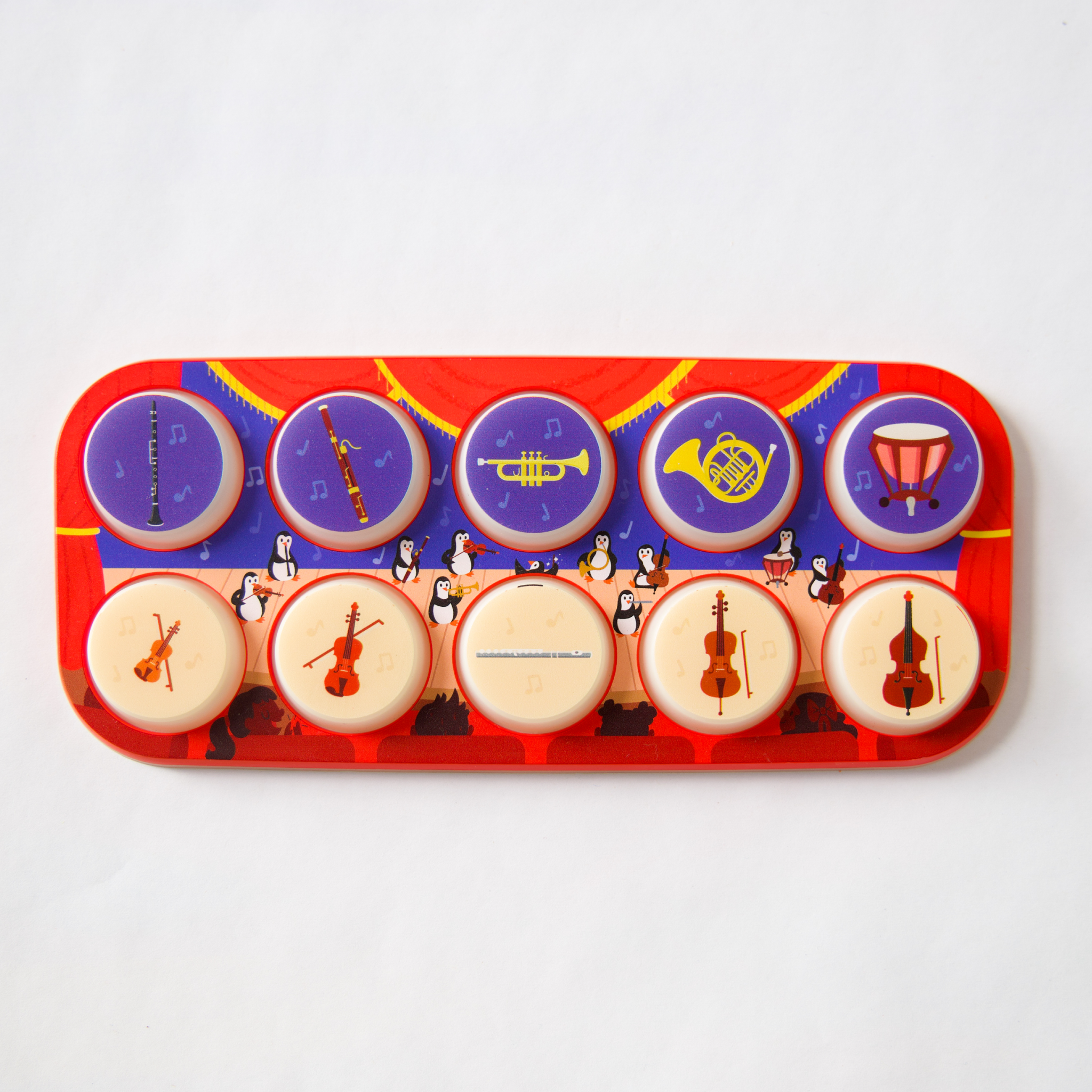 Colorful toy with musical instrument icons on a white background